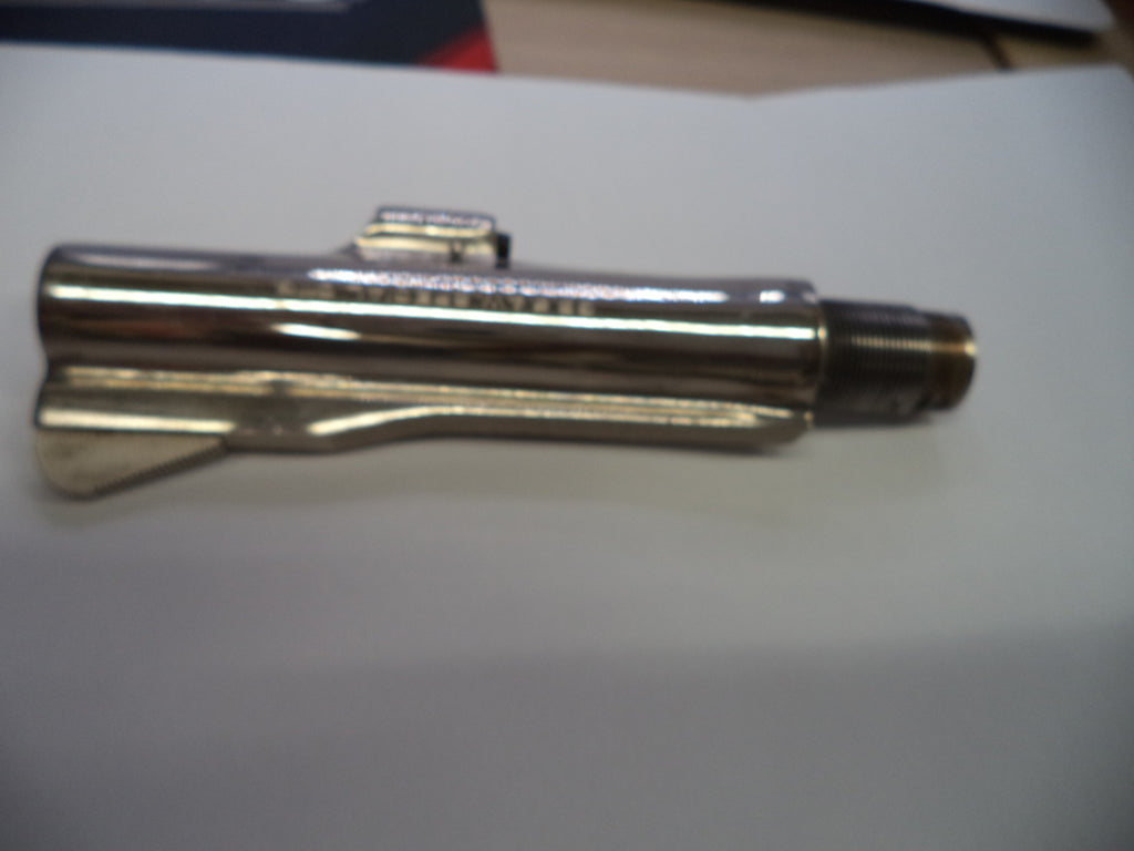 A metallic silver cylindrical tool or hardware piece with a threaded end, photographed on a plain white surface.