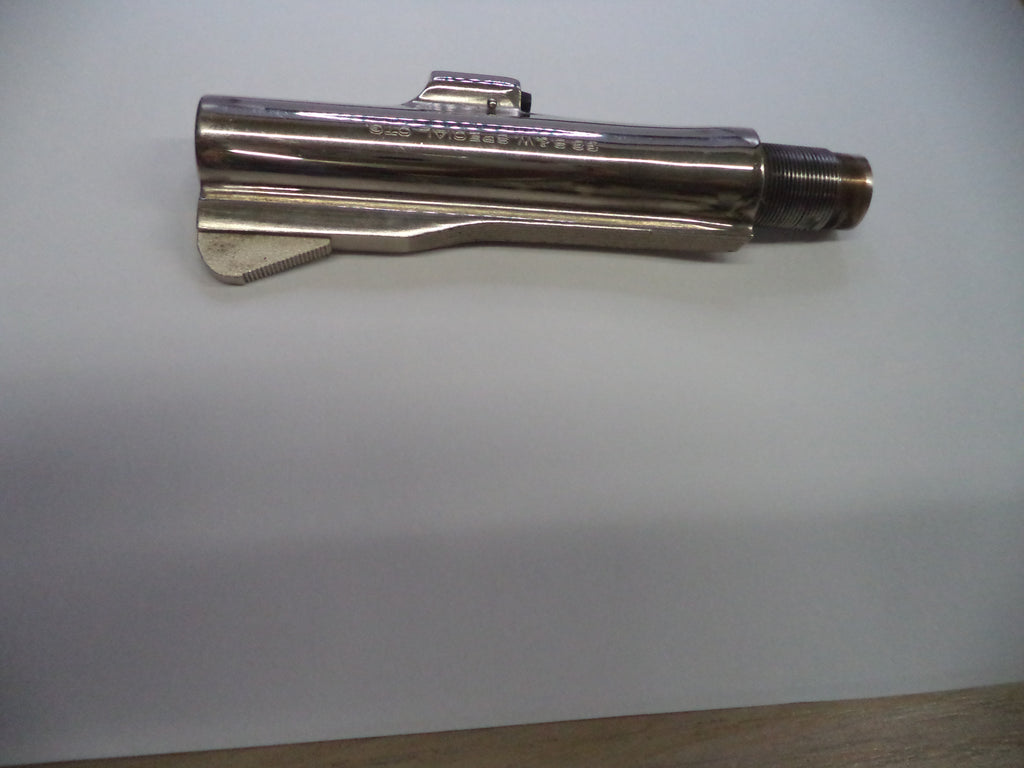 A metallic silver cylindrical tool or hardware piece with engraved text, photographed on a plain light background.