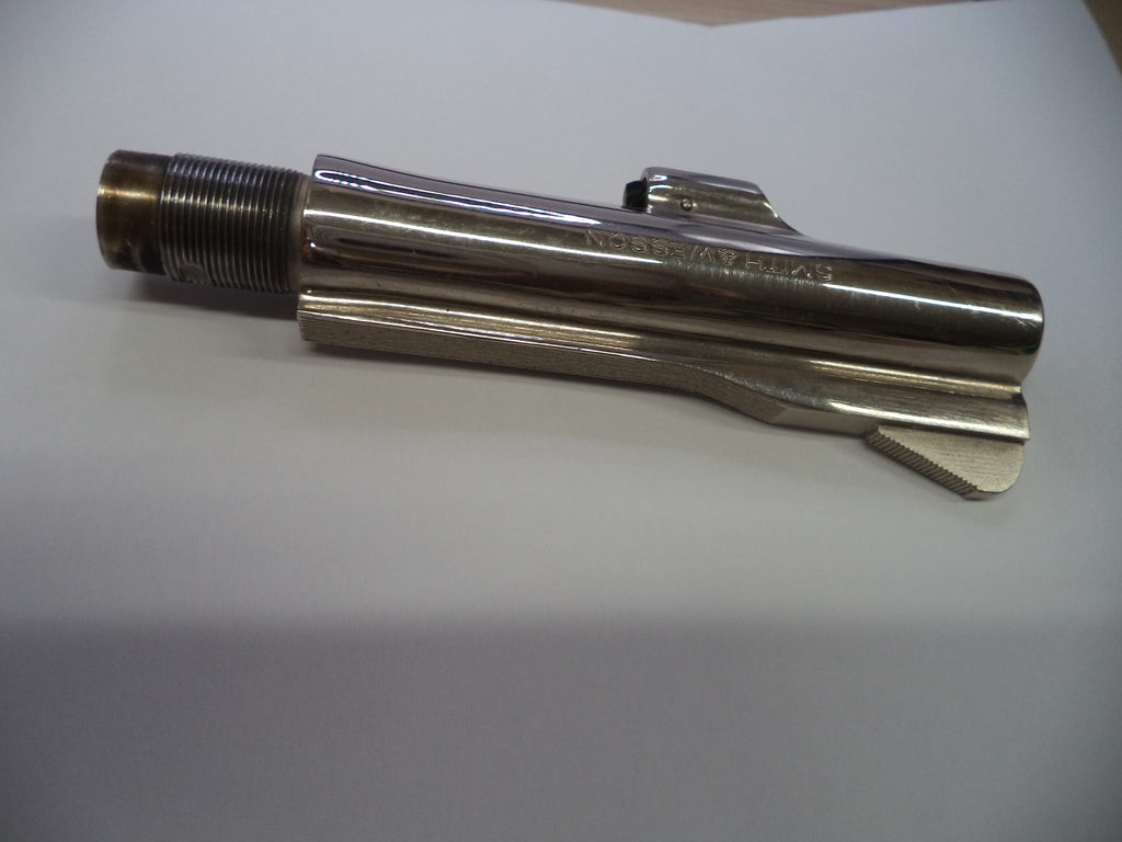 A polished metal pipe fitting or industrial connector with a threaded section and a smooth cylindrical body, photographed on a plain light background.