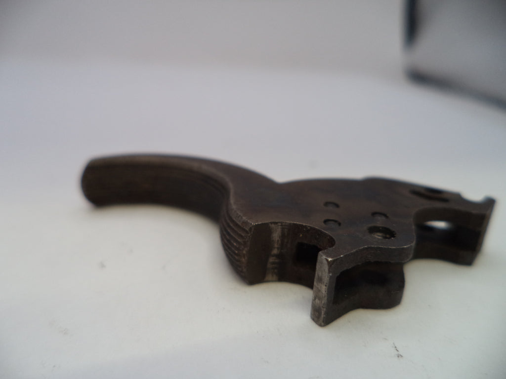A dark metal firearm trigger assembly, likely a receiver trigger or pistol trigger component, shown on a plain white surface.