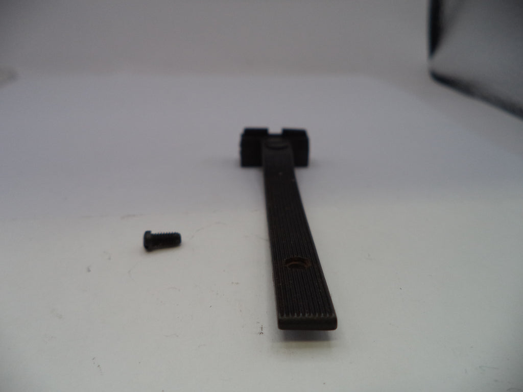 A black textured replacement handle or lever with a small black screw, shown on a plain white surface.