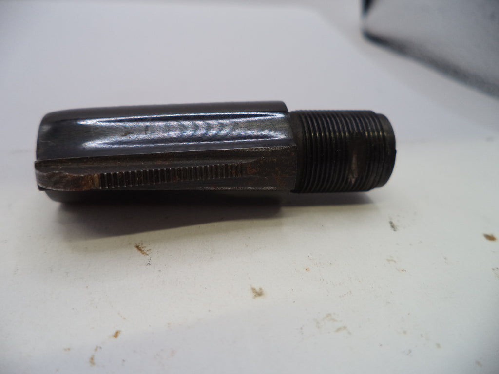 A dark metal threaded tool or hardware piece with a ribbed cylindrical body, photographed on a white surface.
