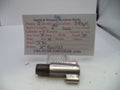 A used metal revolver part, likely a cylinder or frame component, displayed in front of a handwritten paper label card for Smith & Wesson revolver parts.