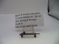 A small metal firearm part labeled 'Smith & Wesson Revolver J Frame Model 36 .38 Cal.