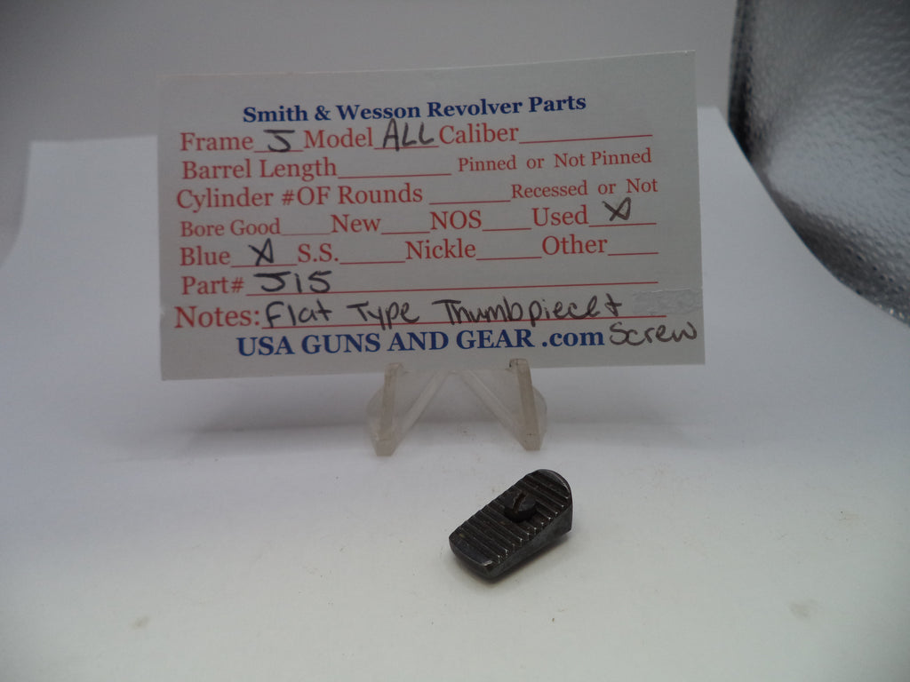A small black metal revolver part displayed below a printed parts identification card on a clear stand, photographed on a white surface.