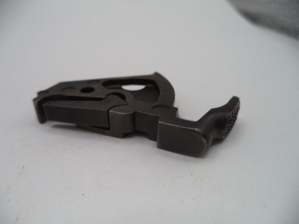A small dark metal hardware component with a textured grip on one end, photographed on a plain light background.