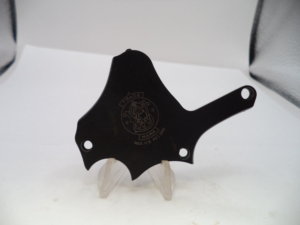 A black metal motorcycle handlebar clip or guard, featuring a circular 'Fuego' brand emblem, displayed on a clear plastic stand against a white background.