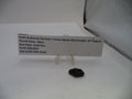 A small black thumb piece for a Smith & Wesson Revolver J Frame Model 360 airweight .357 Magnum handgun, displayed on a clear stand next to a white paper label with product details.