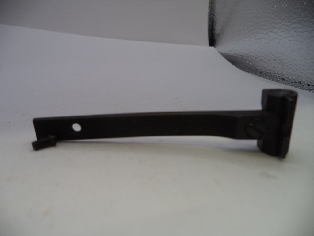 A black metal door stopper or latch arm with a mounting hole, shown on a white surface.