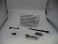 Internal parts of a Smith & Wesson Revolver N Frame Model 29-2 .44 Magnum, including a main spring, bolt, rebound assembly, cylinder stop assembly, and hammer block, displayed on a white surface with a product information card.
