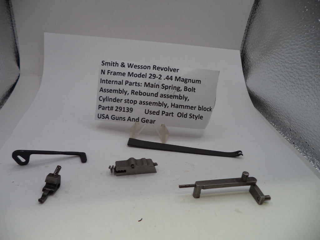 Smith & Wessex Revolver N Frame Model 29-2 .44 Magnum internal parts laid out on a white surface with a printed parts list card behind them, including main spring, bolt, assembly, rebound assembly, cylinder stop assembly, hammer block, and part number 29139.