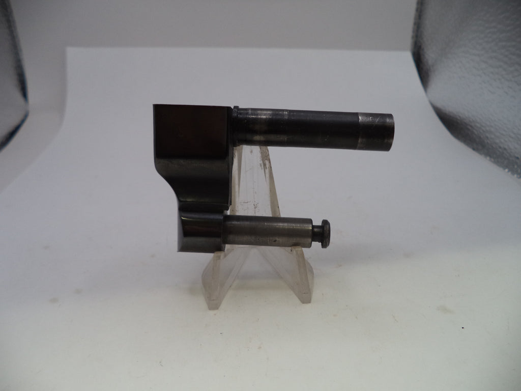 A dark metallic cylindrical tool or hardware piece mounted on a clear plastic display stand against a plain white background.