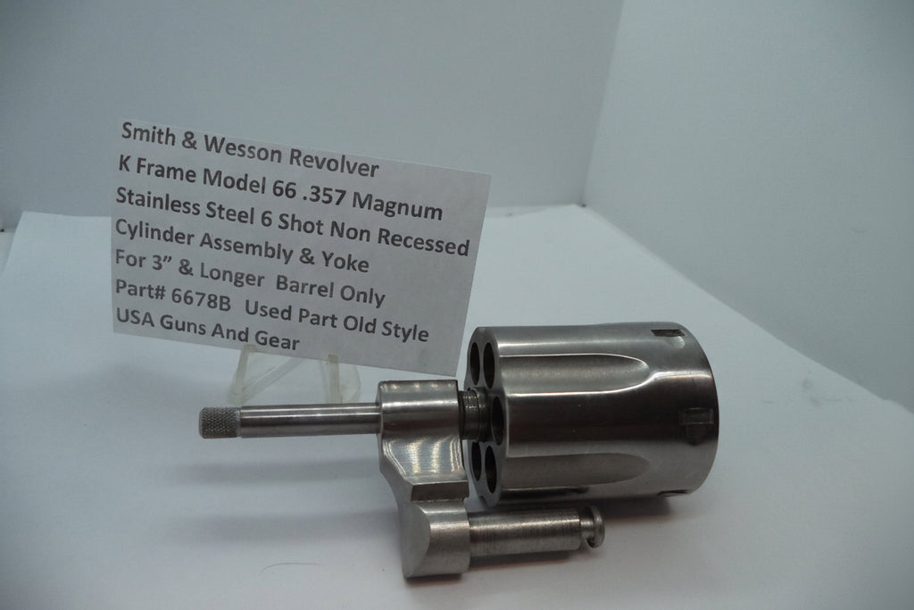 Smith & Wesson revolver cylinder assembly on a white background with a label.