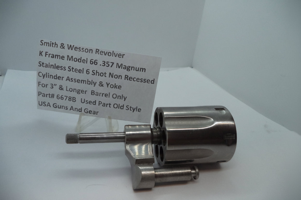 Smith & Wesson revolver cylinder assembly on a white background with a label.
