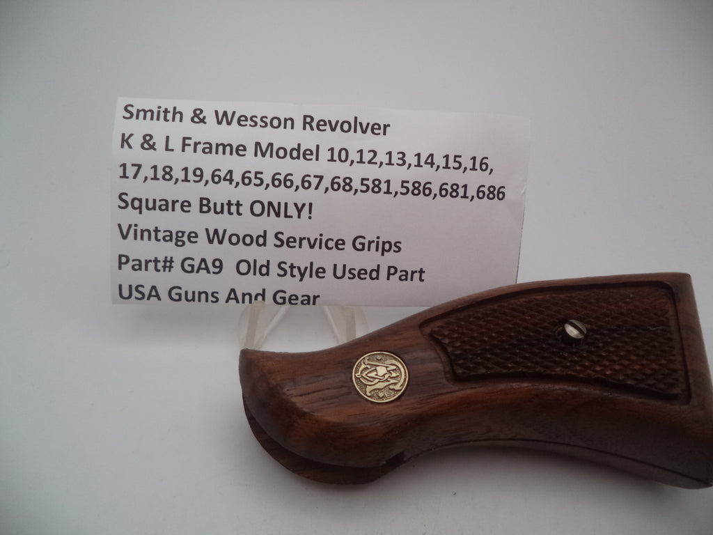A vintage wood service grip for an S&W L Frame multi model pistol, displaying the model number 10 on the tag.