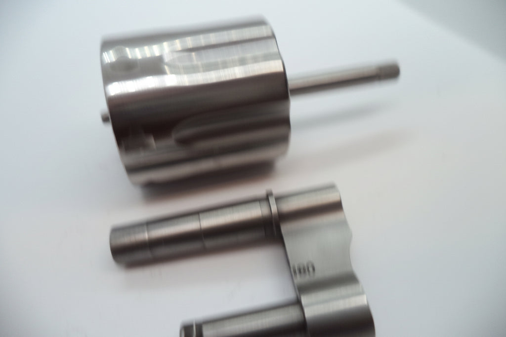 Stainless steel revolver cylinder with model number L686-6 and higher, suitable for 2 1/2 barrel, displayed on a white background with a part number label.