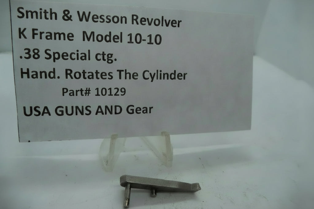 A metal part labeled as a 'K Frame Model 10-10 Hand' cylinder grip for a Smith & Wesson revolver, with the serial number 10129.