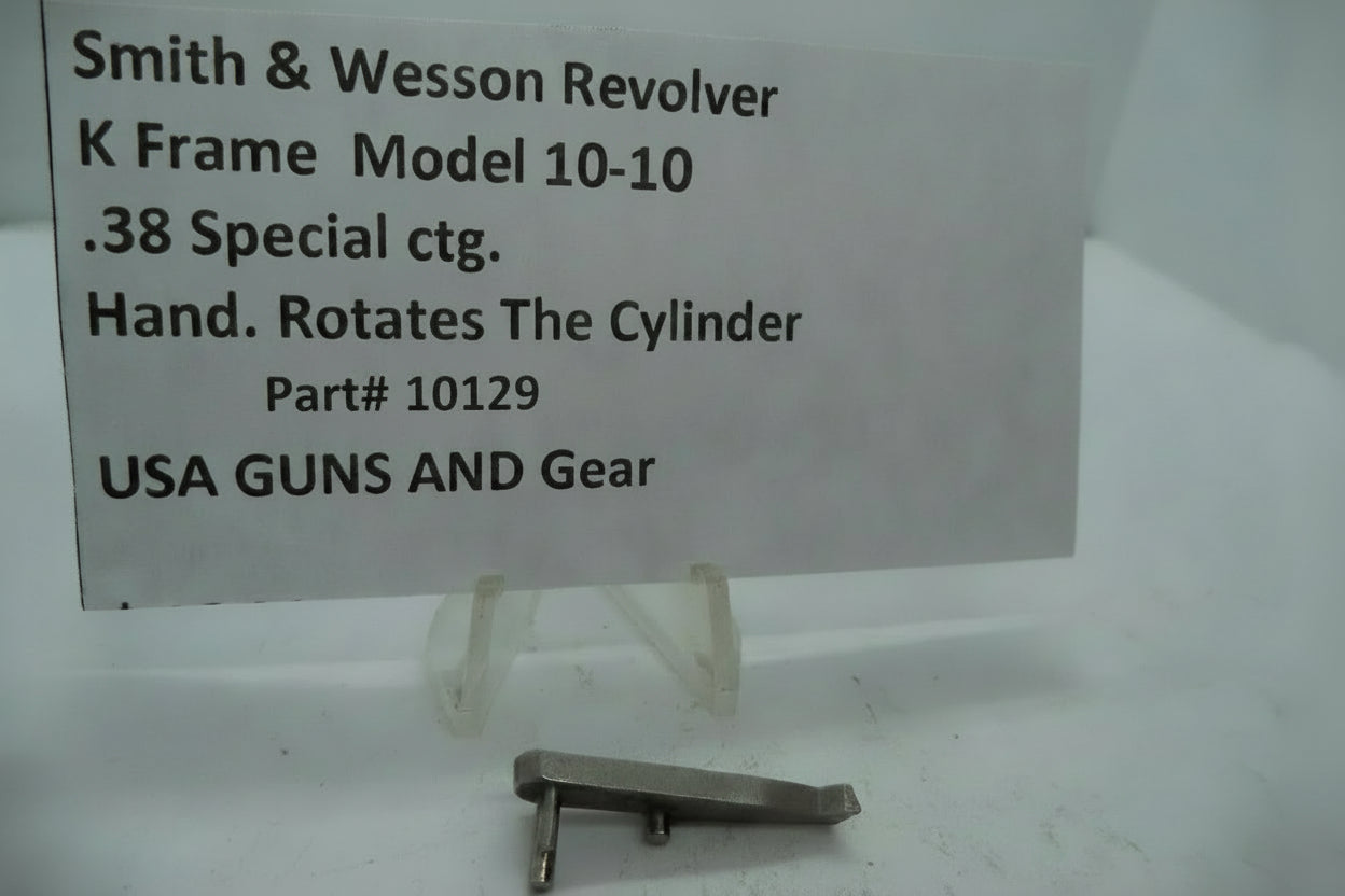 A metal part labeled as a 'K Frame Model 10-10 Hand' cylinder grip for a Smith & Wesson revolver, with the serial number 10129.