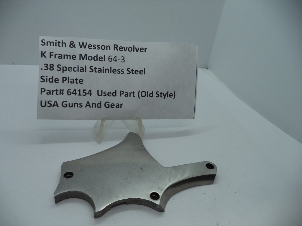 Smith & Wesson K Frame Model 64-3 Side Plate made of stainless steel, displayed as a used gun part with the model number 64154 and side plate designation, on a white background.