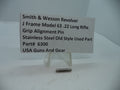A stainless steel grip alignment pin for a Smith & Wesson J Frame Model 63 revolver, displayed on a white stand with a label providing product information.