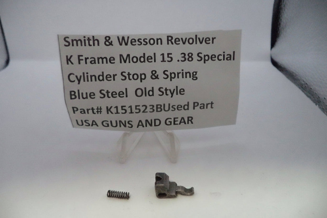 Smith & Wesson revolver parts on a white background with a label.