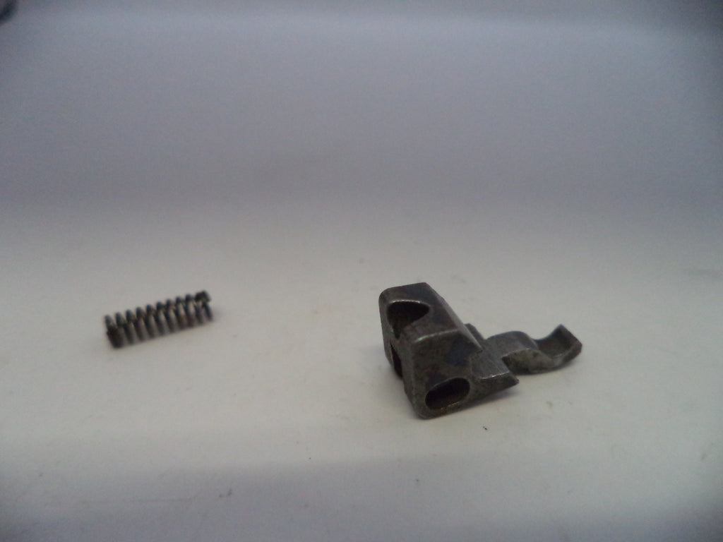 Metal spring and metal bracket on a white background