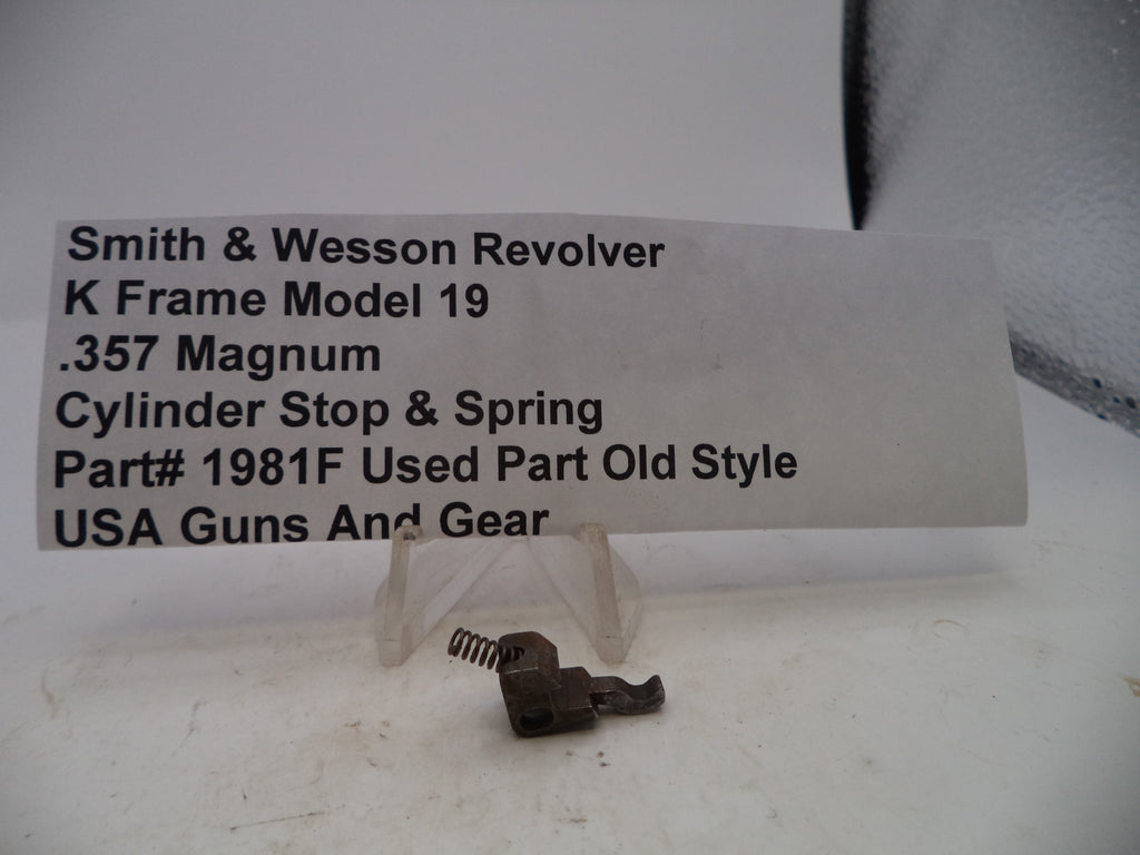 Smith & Wesson revolver parts on a white background with a label.