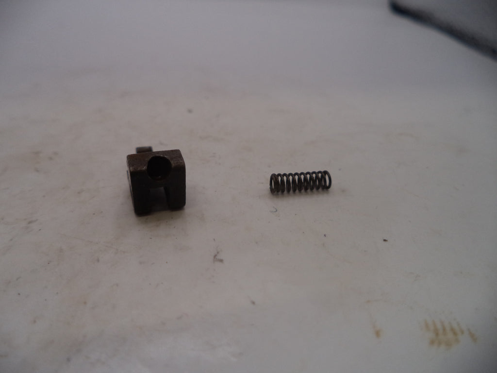 Small metal component and spring on a worn surface