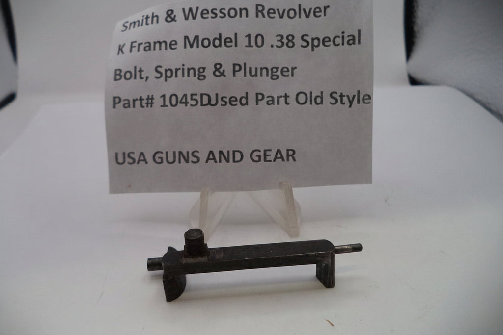 Smith & Wesson revolver part on a stand with a label