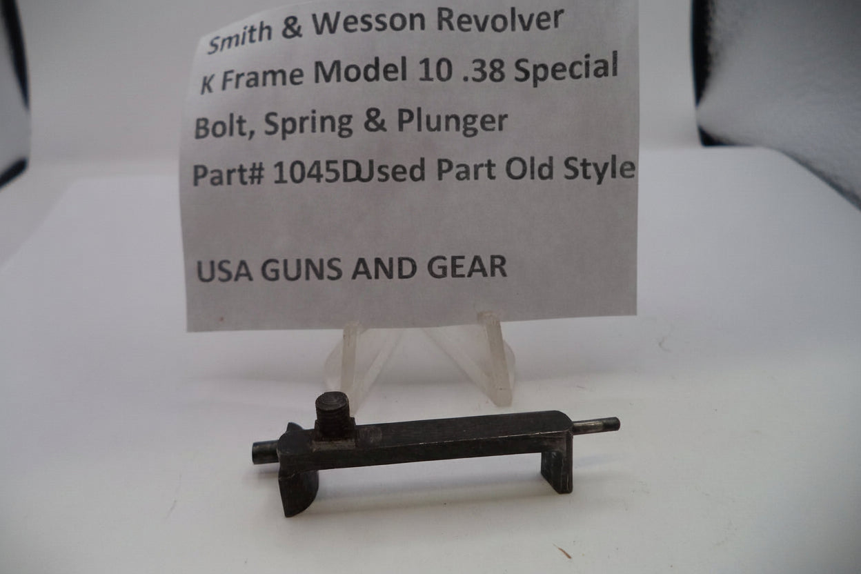 Smith & Wesson revolver part on a stand with a label
