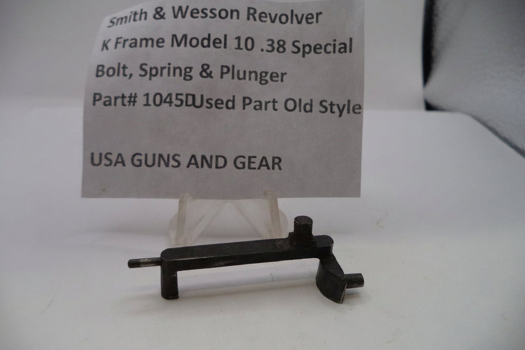 Smith & Wesson revolver part with descriptive card on a white background