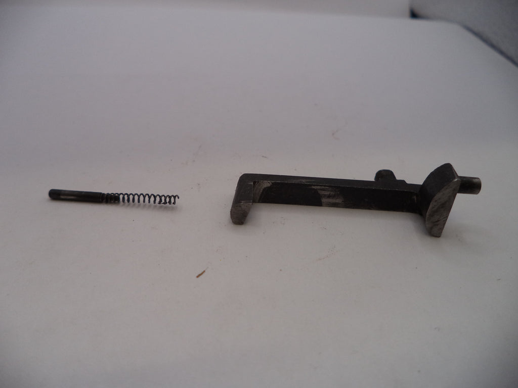Two metal components on a white surface