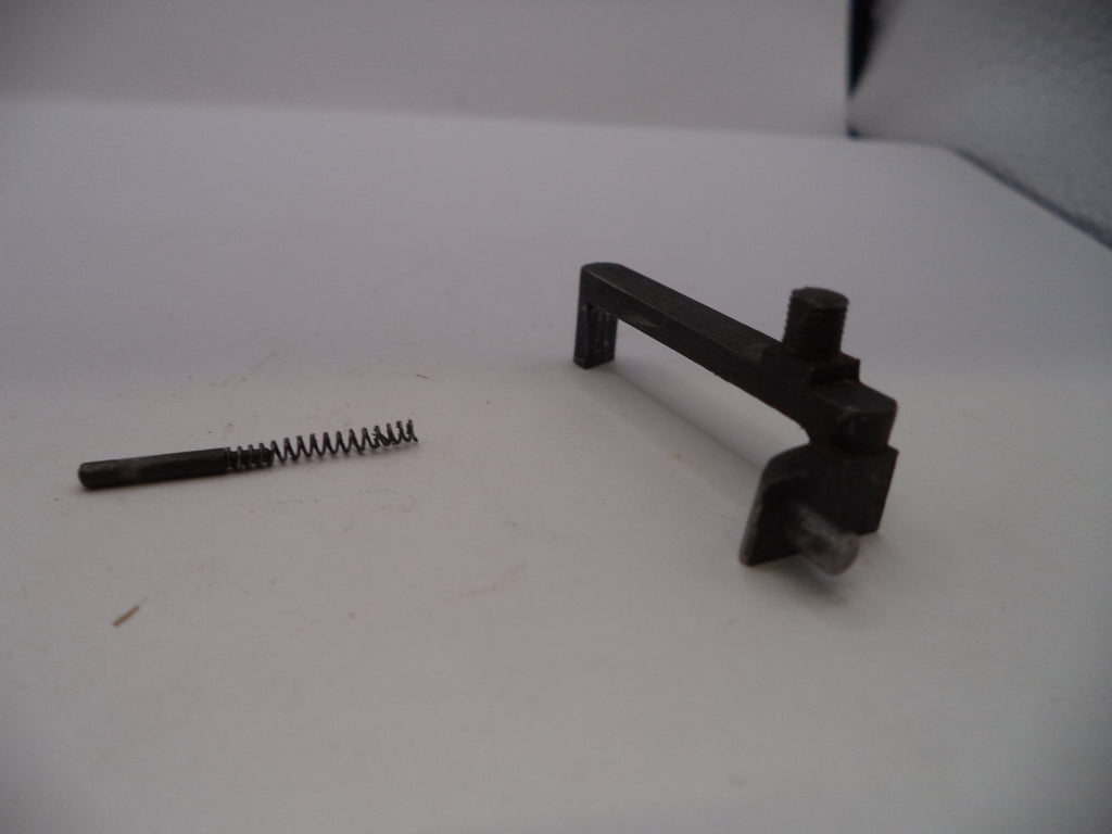 Two metal components on a white surface