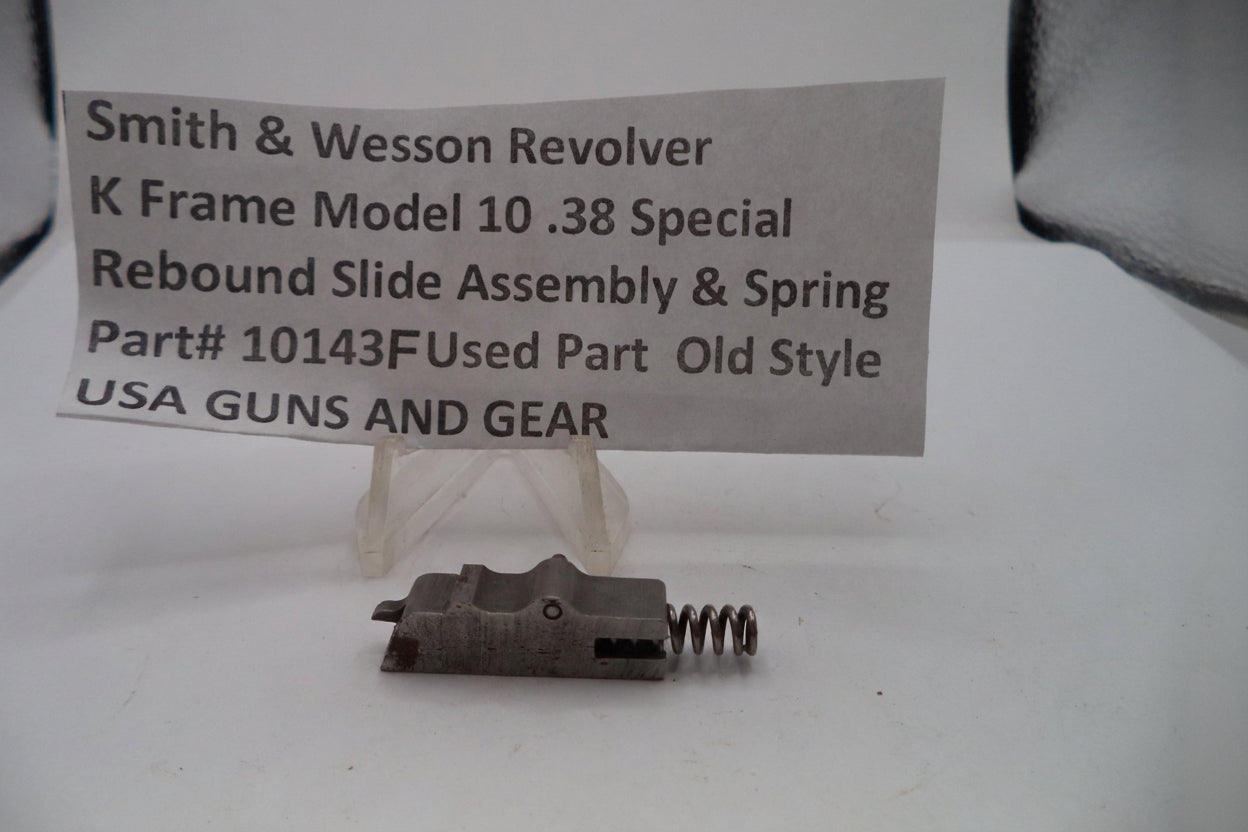 Smith & Wesson revolver K Frame Model 10 .38 Special rebound slide assembly and spring on a white background with a label.