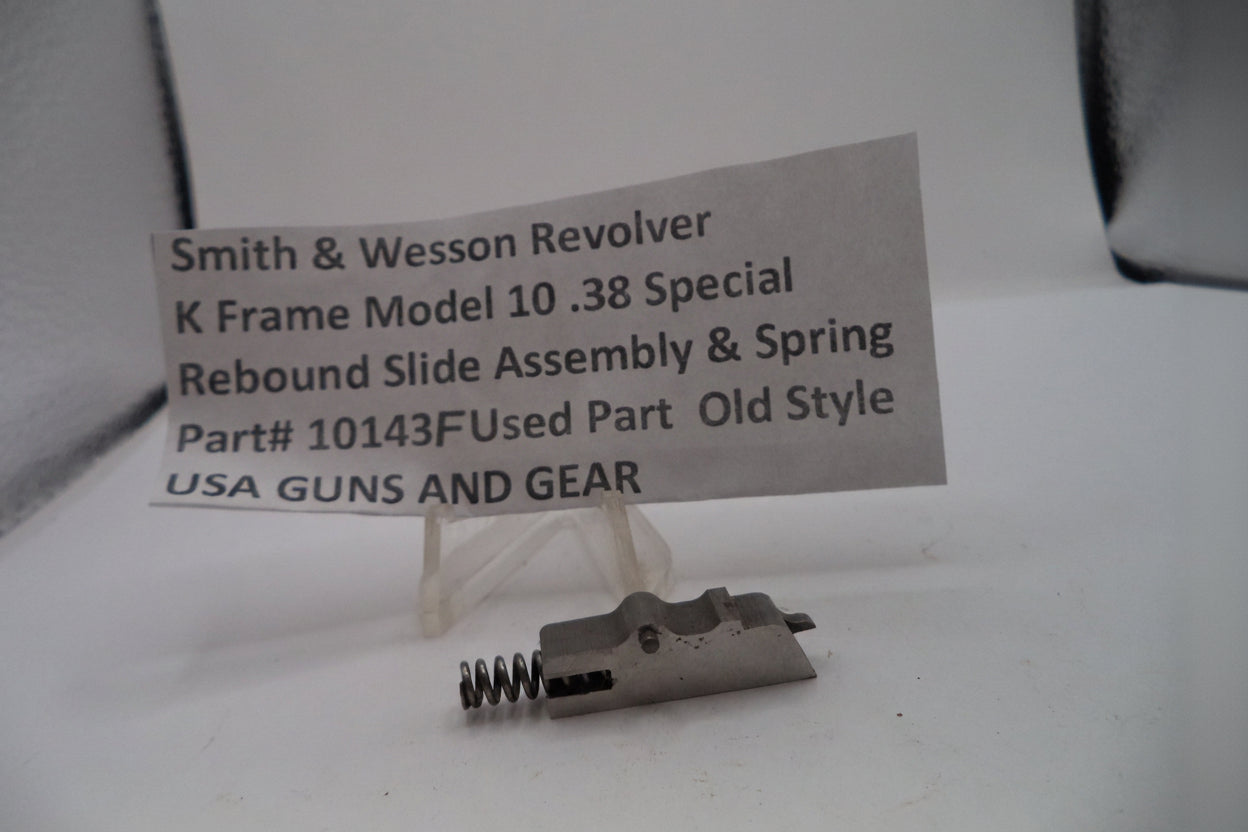 Smith & Wesson revolver part with a label on a white background