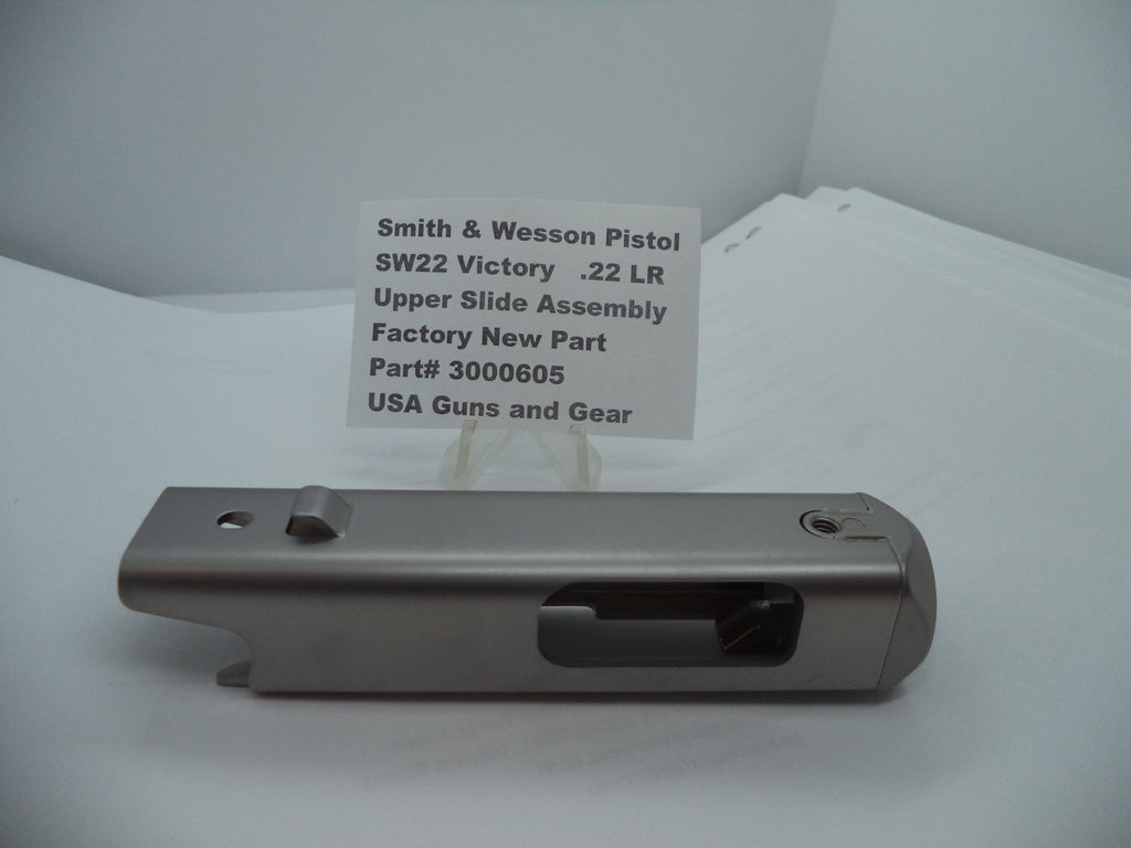 Smith & Wesson SW22 Victory Upper Slide Assembly for .22 LR pistol, silver finish, displayed on a white background with product information sign.