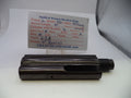 A black metal Smith & Wesson revolver barrel part displayed on a white surface with a branded parts card behind it.