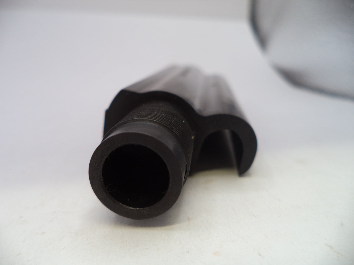 A close-up of a black plastic curved component, possibly a nozzle or nozzle sleeve, on a white surface.
