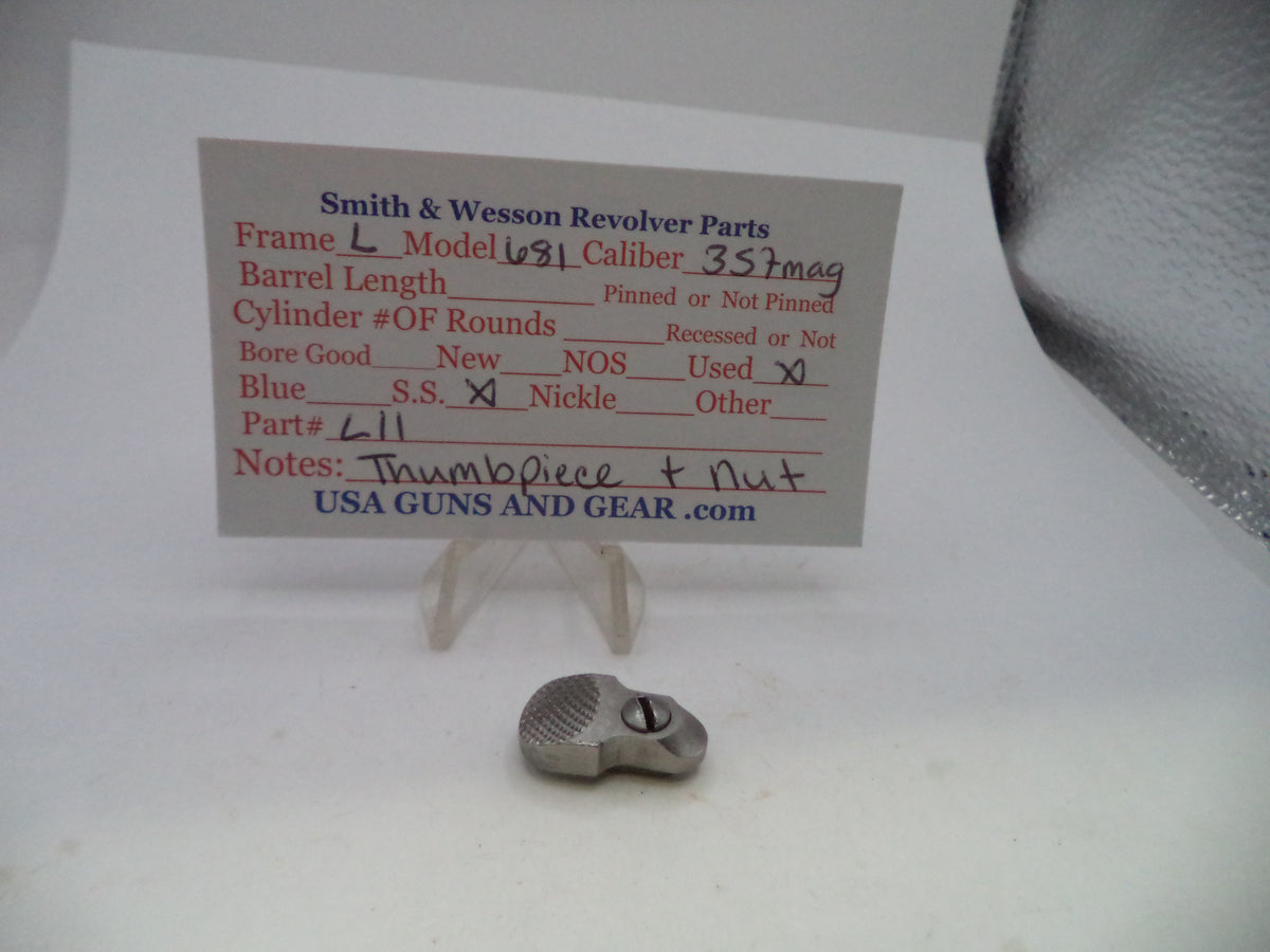 A small metallic revolver part displayed on a clear stand in front of a printed parts information card for Smith & Wesson revolvers, on a white surface.
