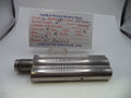 A metal cylindrical gun part with a threaded male end, shown on a white surface with a handwritten paper label card behind it reading Smith & Wesson Revolver Parts.