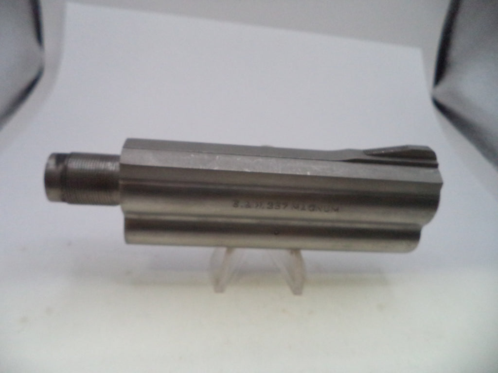 A metal cylindrical tool bit or machined part with a threaded end, displayed on a small clear stand against a plain light background.
