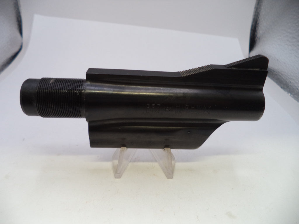A black metal machined part, likely a tool bit or industrial component, displayed on clear plastic stands against a white background.