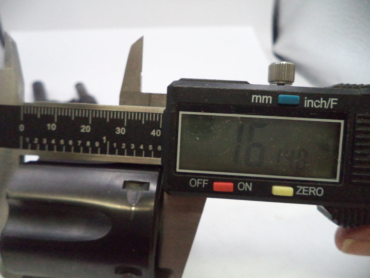 Close-up of a digital caliper measuring a metallic object, with the display reading 16.00 mm.
