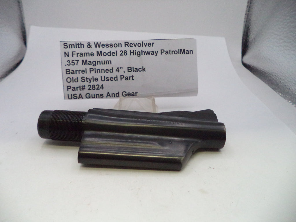 A black metal barrel pinning part for a Smith & Wesson revolver, displayed on a white surface with a product information card behind it.