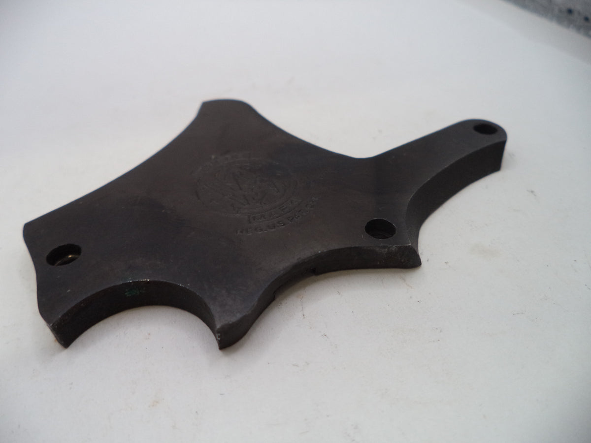 A dark gray cast metal mounting bracket with four pre-drilled holes, photographed on a white surface.