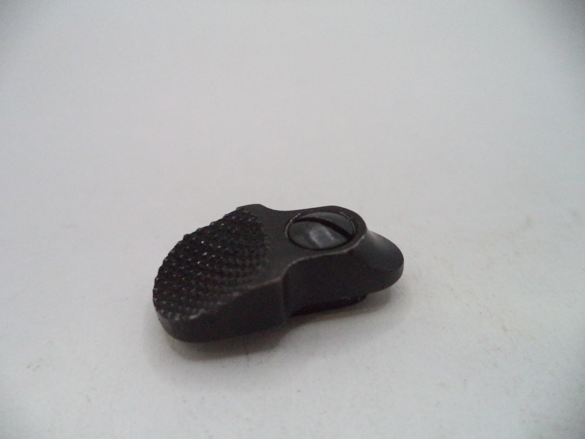 A small black textured plastic or rubber accessory with a circular opening, photographed on a plain light background.