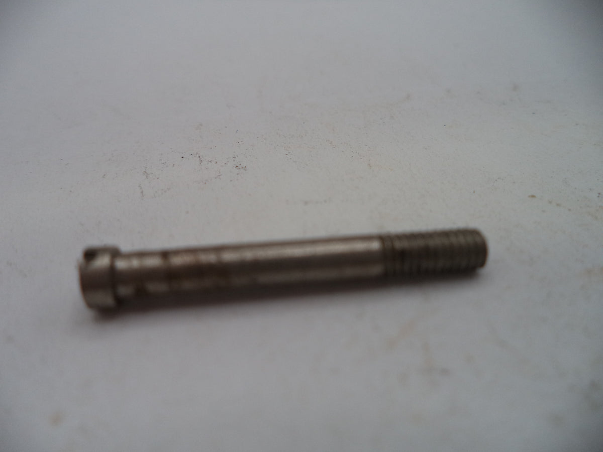 A small metal threaded bolt or pin with a cylindrical head, shown on a plain off-white surface.