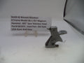 Smith & Wesson revolver part on a white surface with descriptive text card.