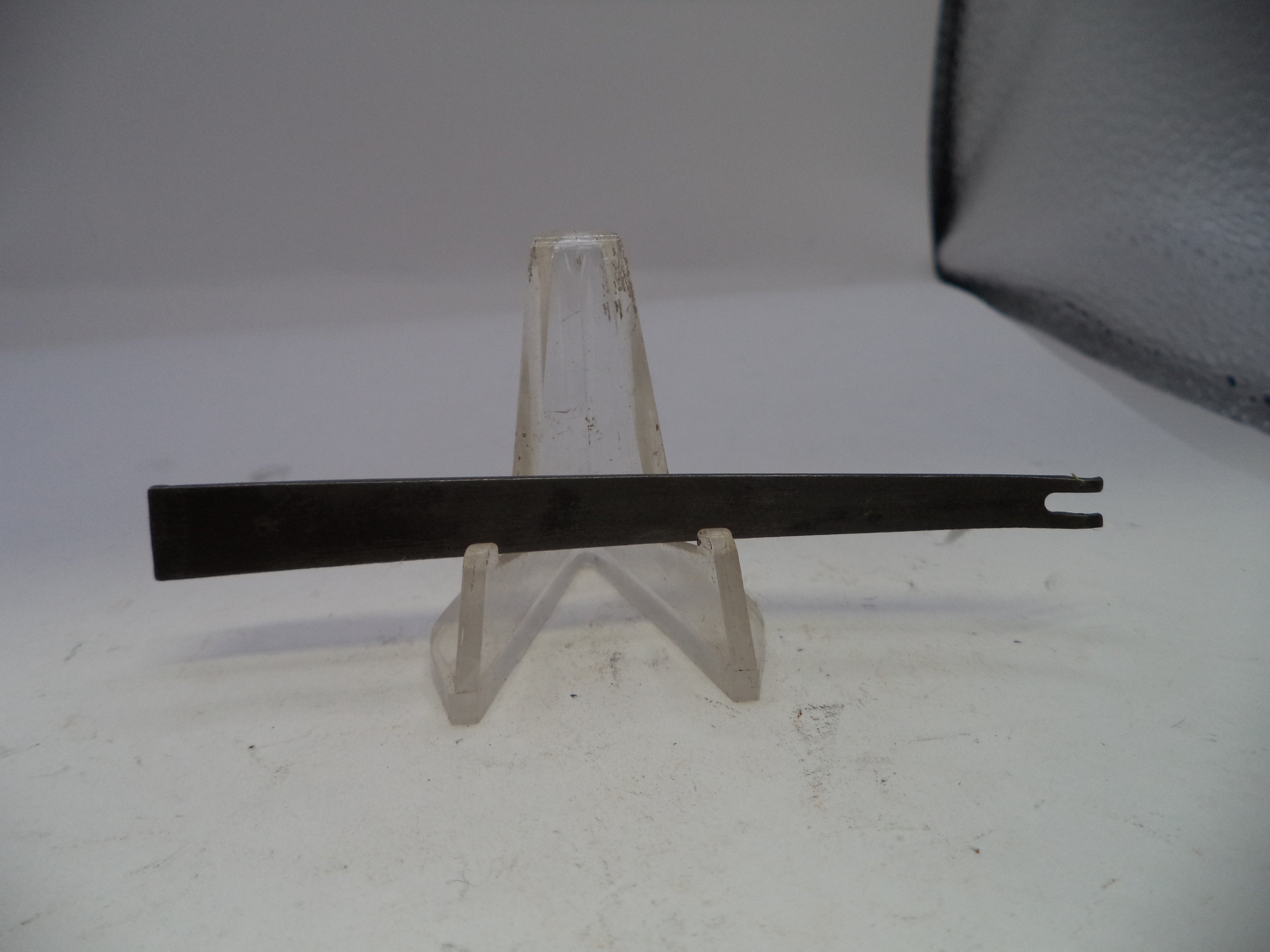 Metal bar on a stand against a white background