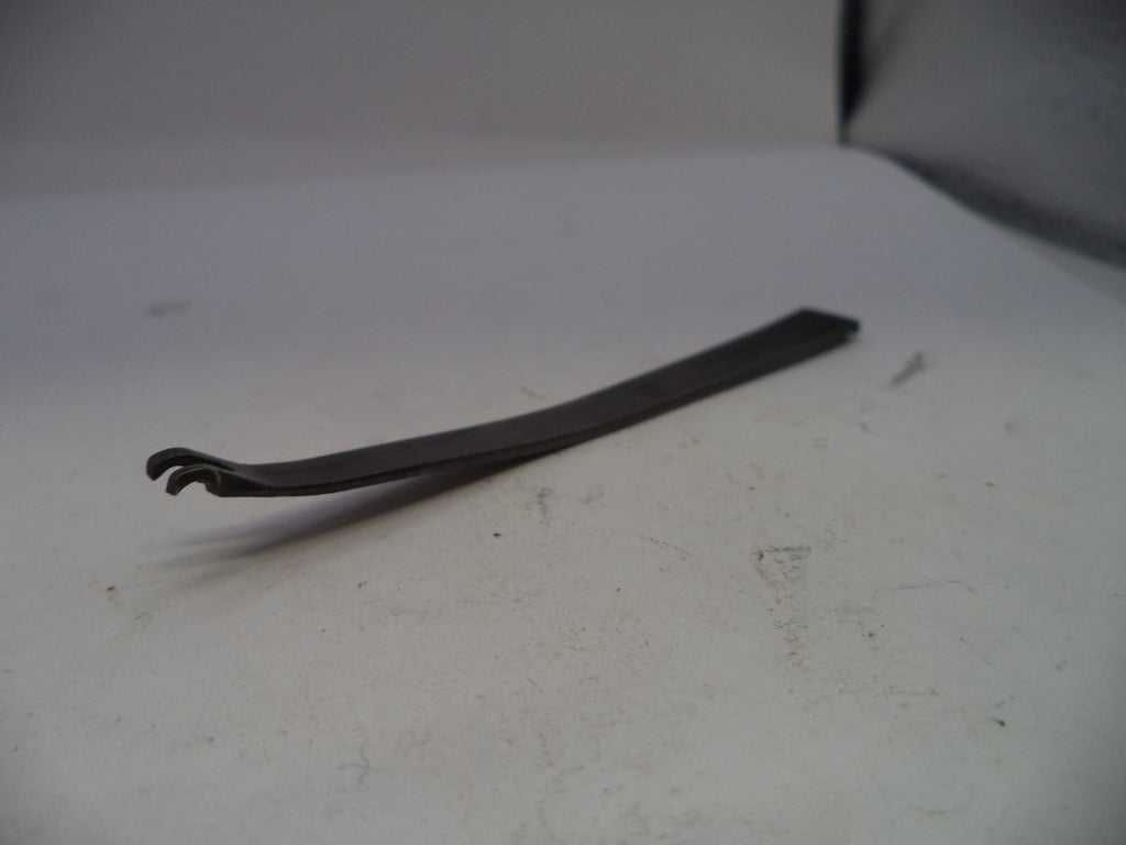 Metal tool on a white surface